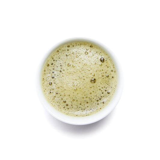 Organic green tea matcha in a cup by Wild Orchard