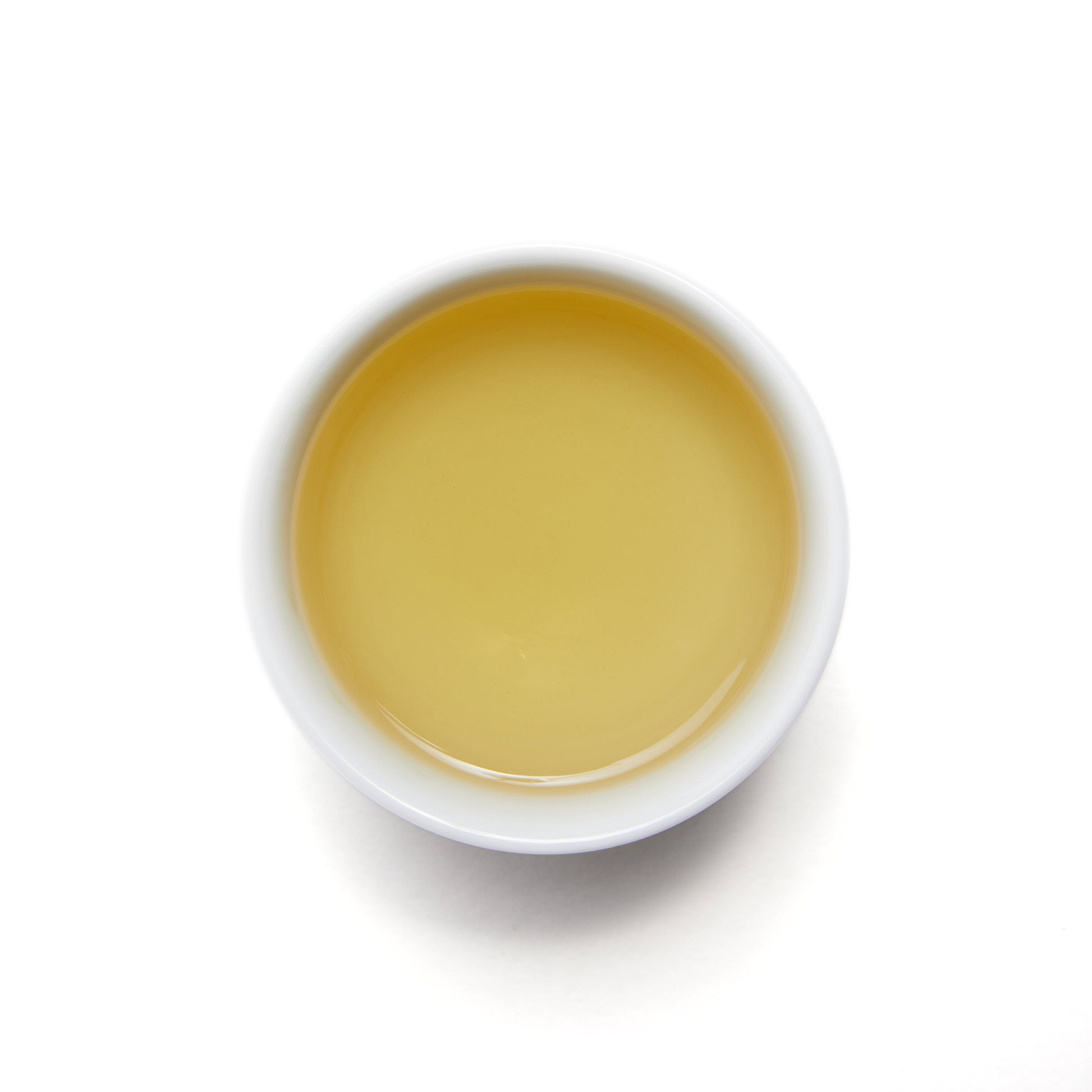 Morning Citrus - Loose Leaf Green Tea by Wild Orchard Tea, image of brewed tea in a cup